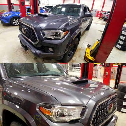 Picture of grey 2018 Toyota Tacoma in mechanic bay with PPF applied